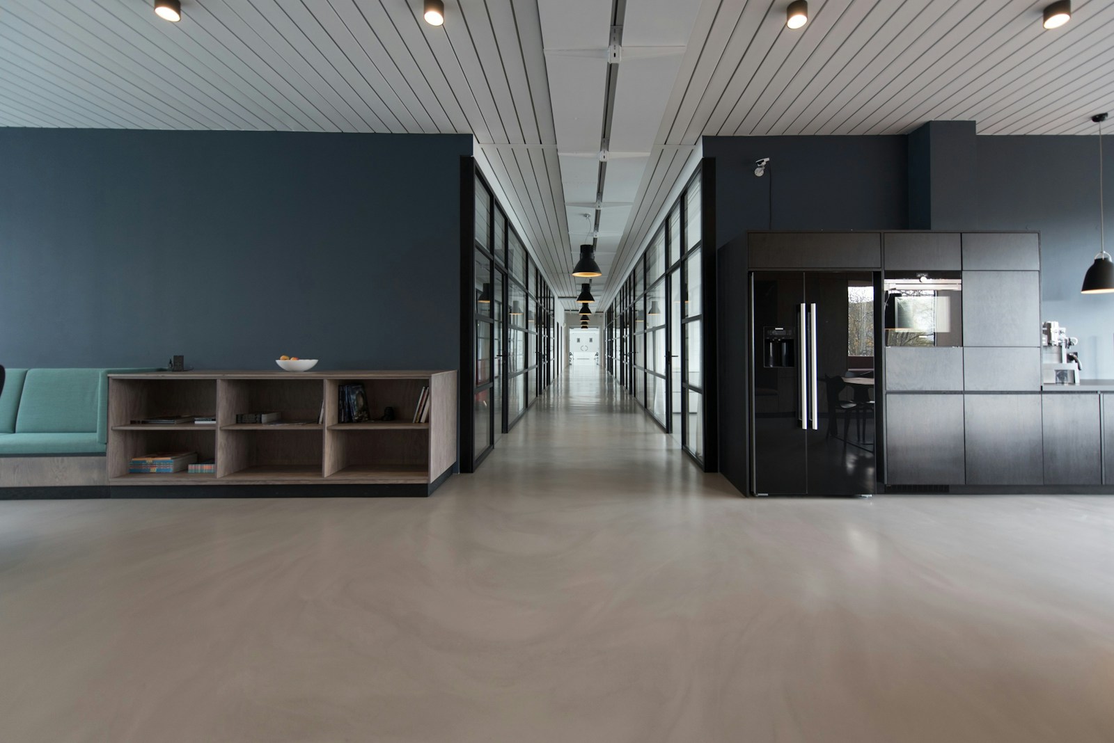Prime Estate Group agency reception with refined marble and wood interior at Orchard Road